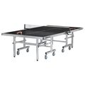 Brunswick Smash 7.0 indoor/outdoor ping pong table with a black top, silver folding frame, large caster wheels and net.