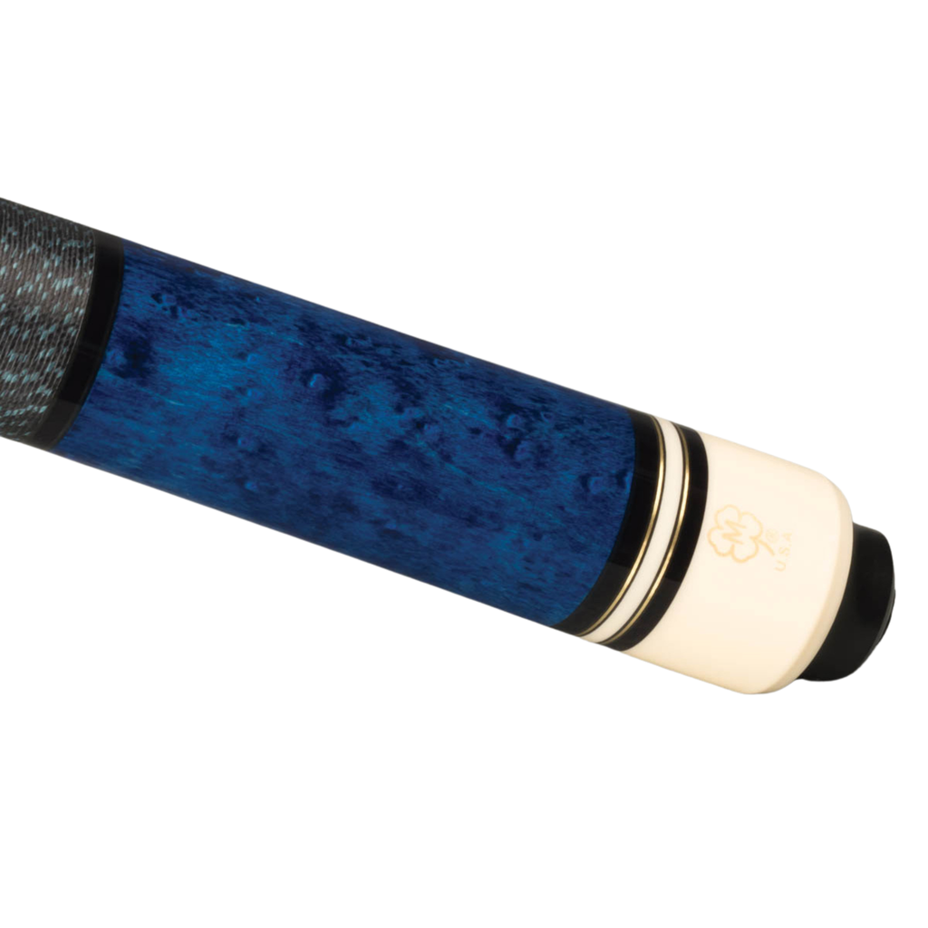 Close-up of a billiards cue shaft featuring a dark blue and black mottled wood grain finish, a textured black grip, and a cream-colored end piece with gold stripes and a tree logo.