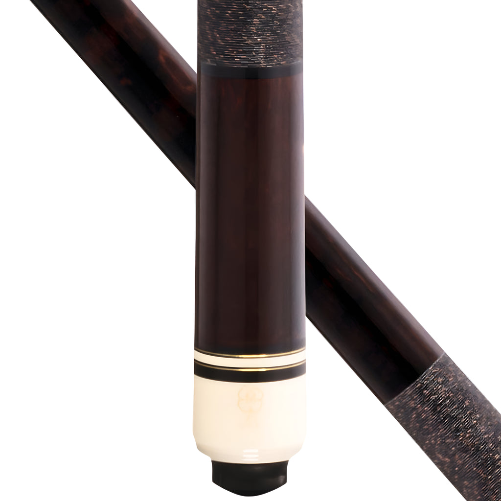 Close-up of a billiards cue stick showing the dark brown wood shaft, a cream-colored butt, and a black tip, with a second diagonal view of the shaft in the background.