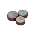 Three round Triangle cue tips with brown sides and pale, coarse-textured tops, grouped on a white background.