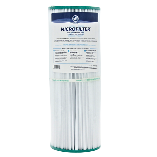 A cylindrical reusable hot tub filter cartridge with a white pleated paper filter body, teal green end caps, and a white paper label featuring blue branding and text.