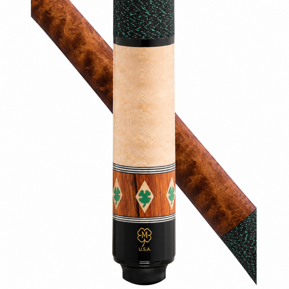 Close-up of a cue stick shaft and end cap on a white background, showing a light natural wood grip, decorative inlay with green clovers and wood panels, and a black end piece with a gold logo and 'U.S.