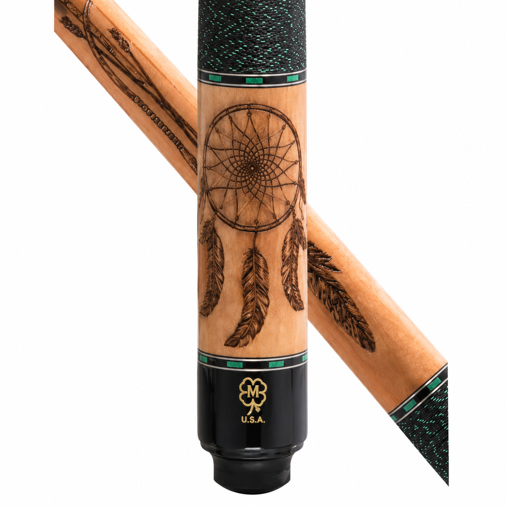 A close-up studio shot of a wooden cue shaft with a dreamcatcher design engraved on the front, black ferrule ends, and a gold U.S.
