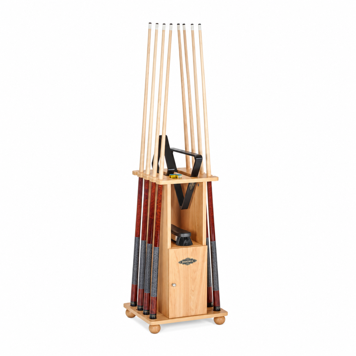 A light "hickory" wood grained Floor cue rack, shown holding 8 pool cues with a 8 ball and 9 ball rack. on a shelf below there is a pool table brush, all on a plain white background.